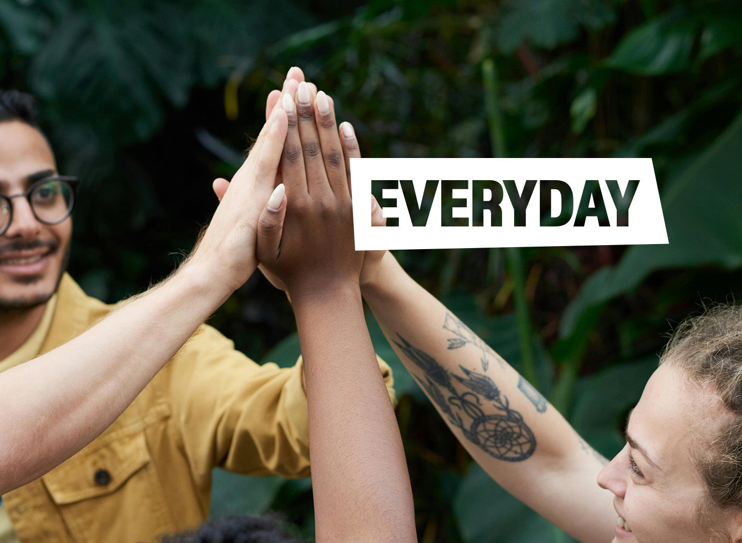 Two people giving a high-five with 'EVERYDAY' text overlay against a green leafy background