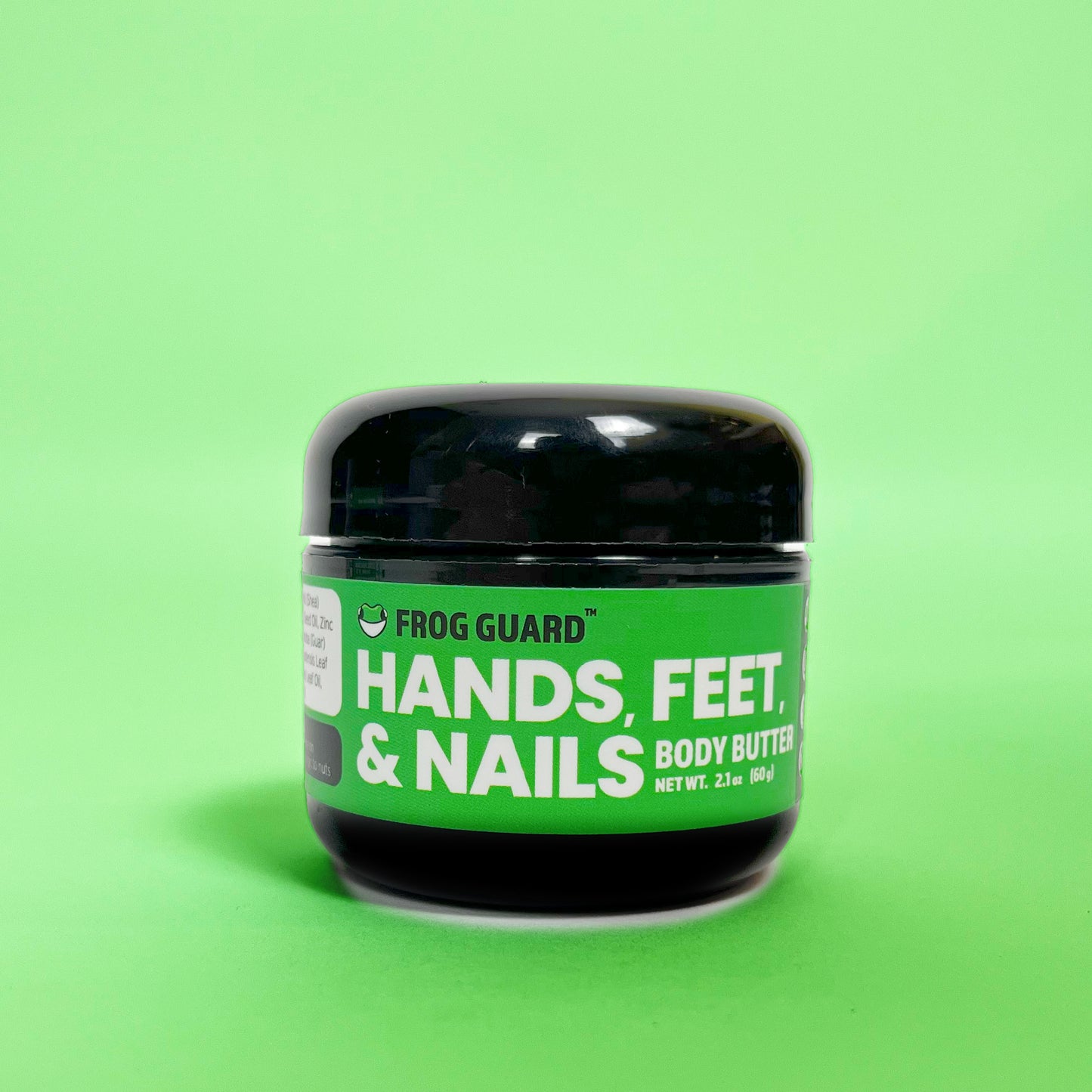Frog Guard body butter 'Hands Feet & Nails' medium product on a green background.