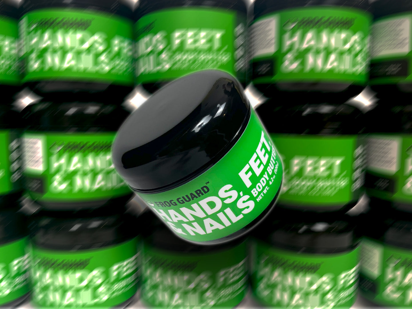 Multiple jars of Frog Guard 'Hands, Feet & Nails' product with green labels and black lids.